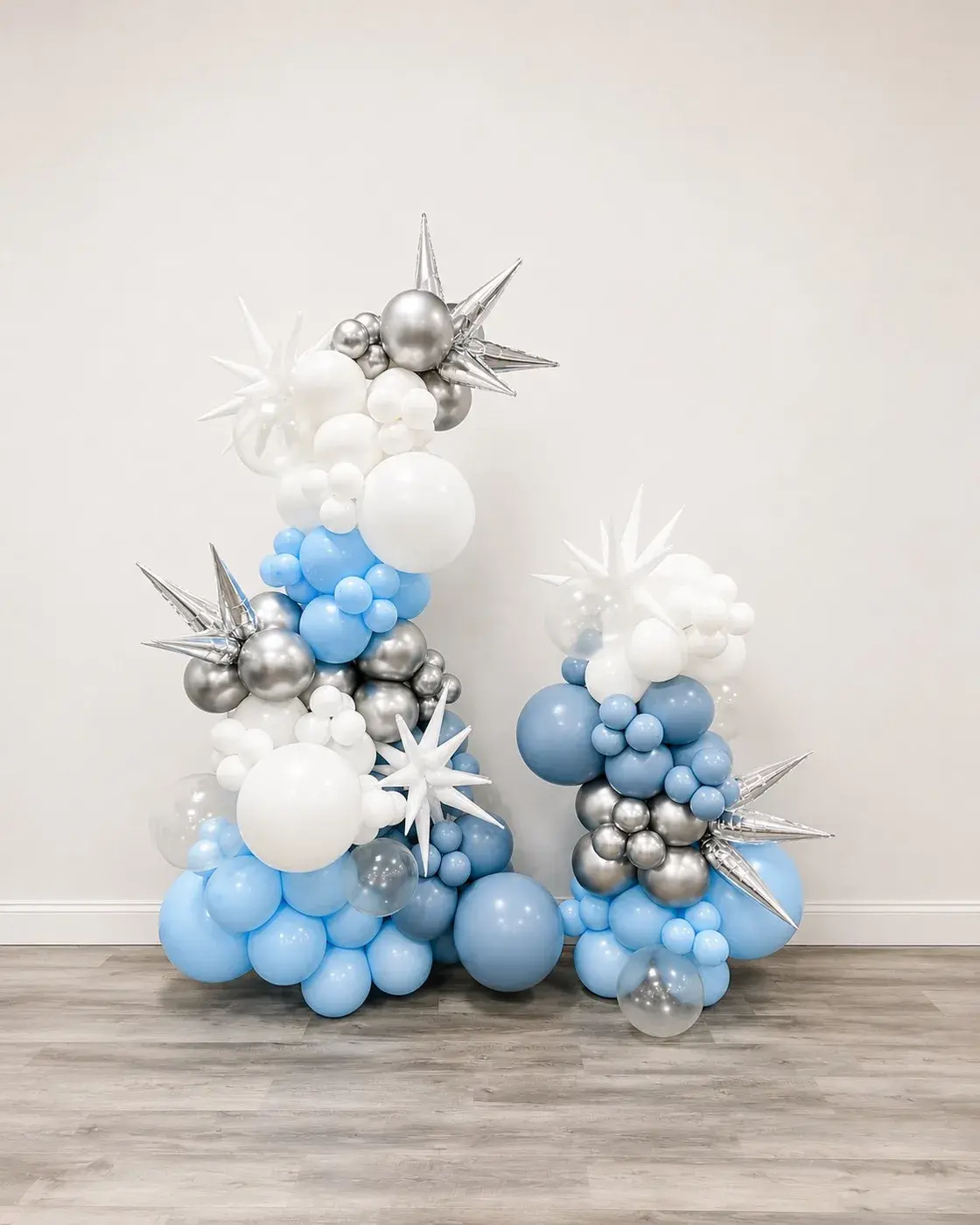 Blue, white and silver balloon cluster with silver star bursts