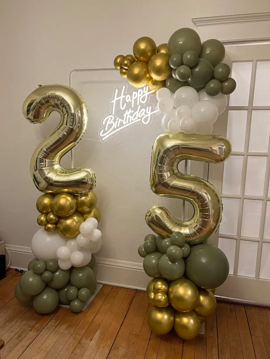 Gold 2 and 5 numbers flanked by olive and gold columns under a neon sign