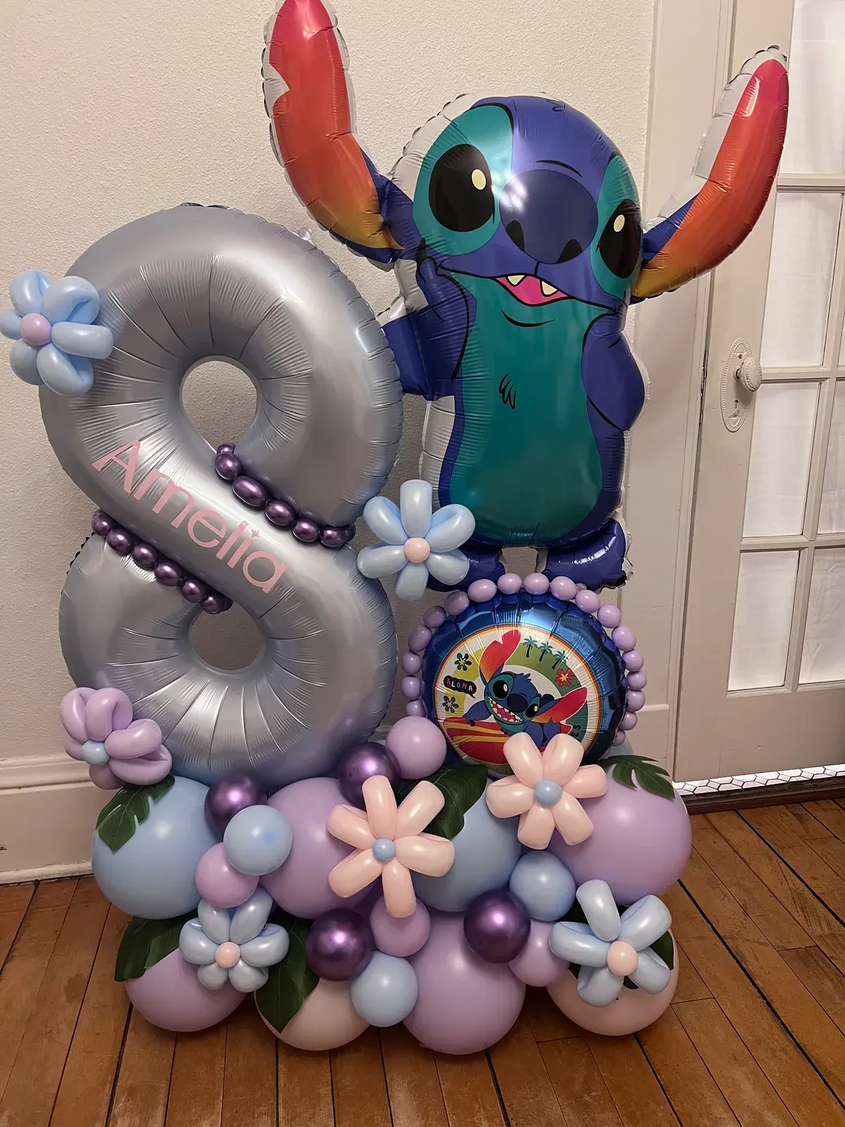 Silver number eight with a character topper, balloon flowers and a personalised name